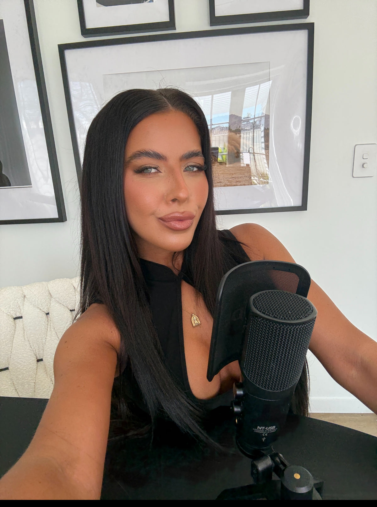 Henny Moody, founder of Feel Good Naked, recording at her podcast mic