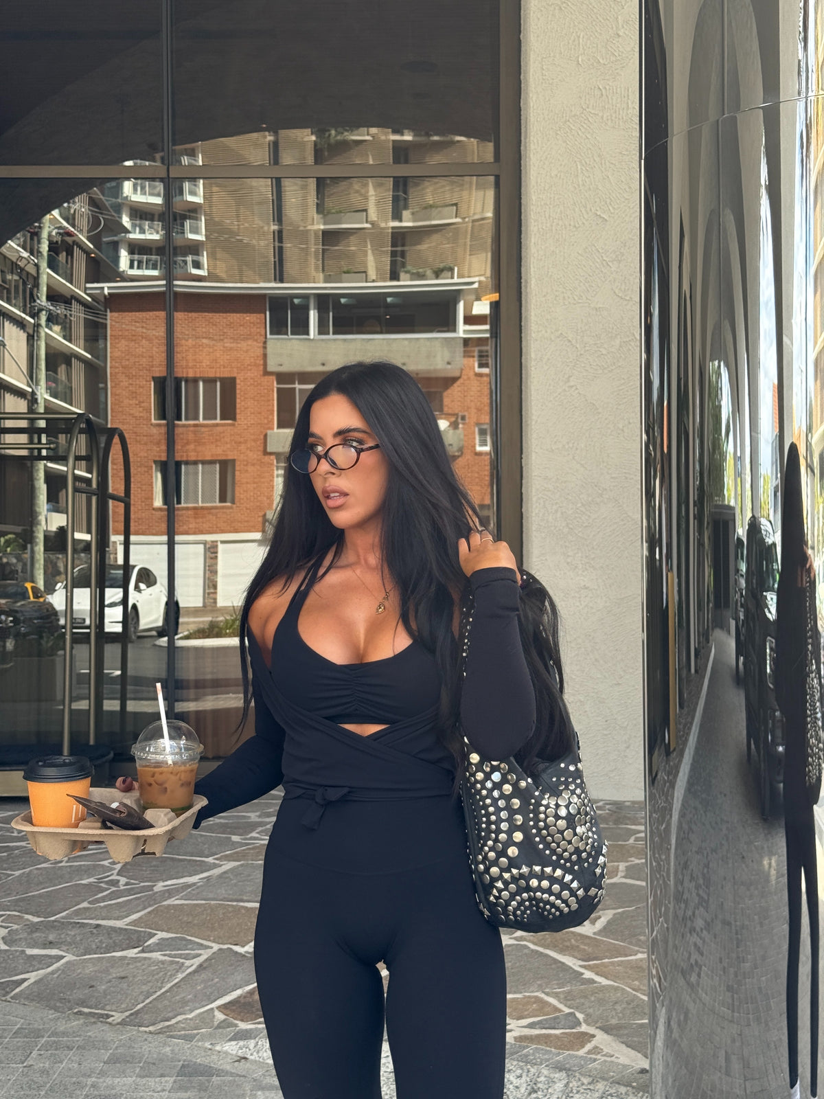 Henny Moody, founder of Feel Good Naked, on the street with a coffee